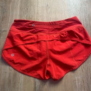 These are size two lululemon speedup shorts. Amazing bright red color.